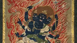 Eine buddhistische Malerei zeigt eine blaue Gottheit mit drei Gesichtern und sechs Armen inmitten von Flammen.